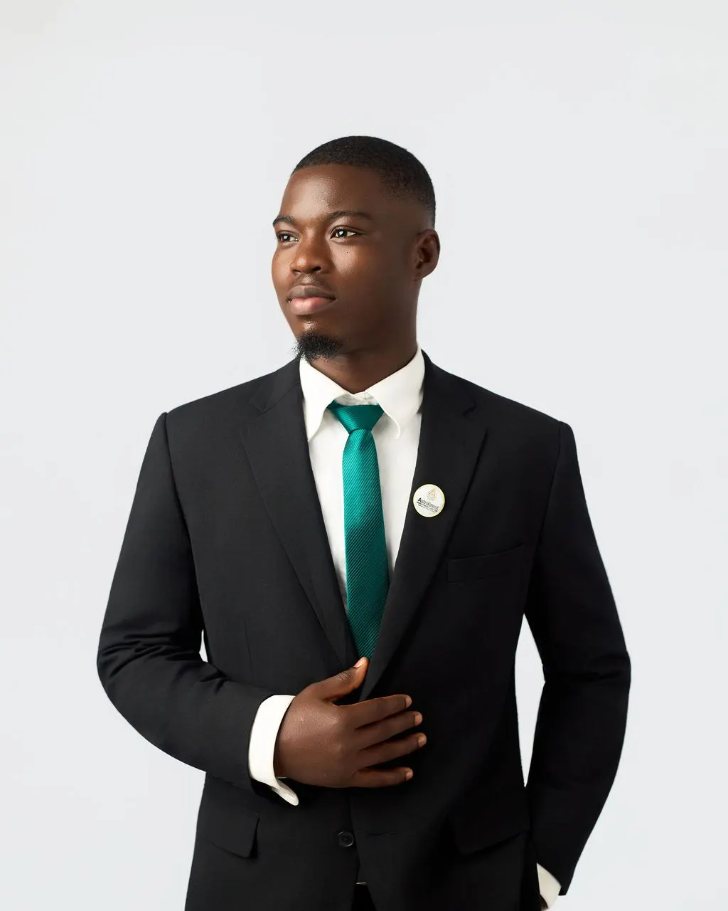 An Astracrest adviser in a dark suit and green tie