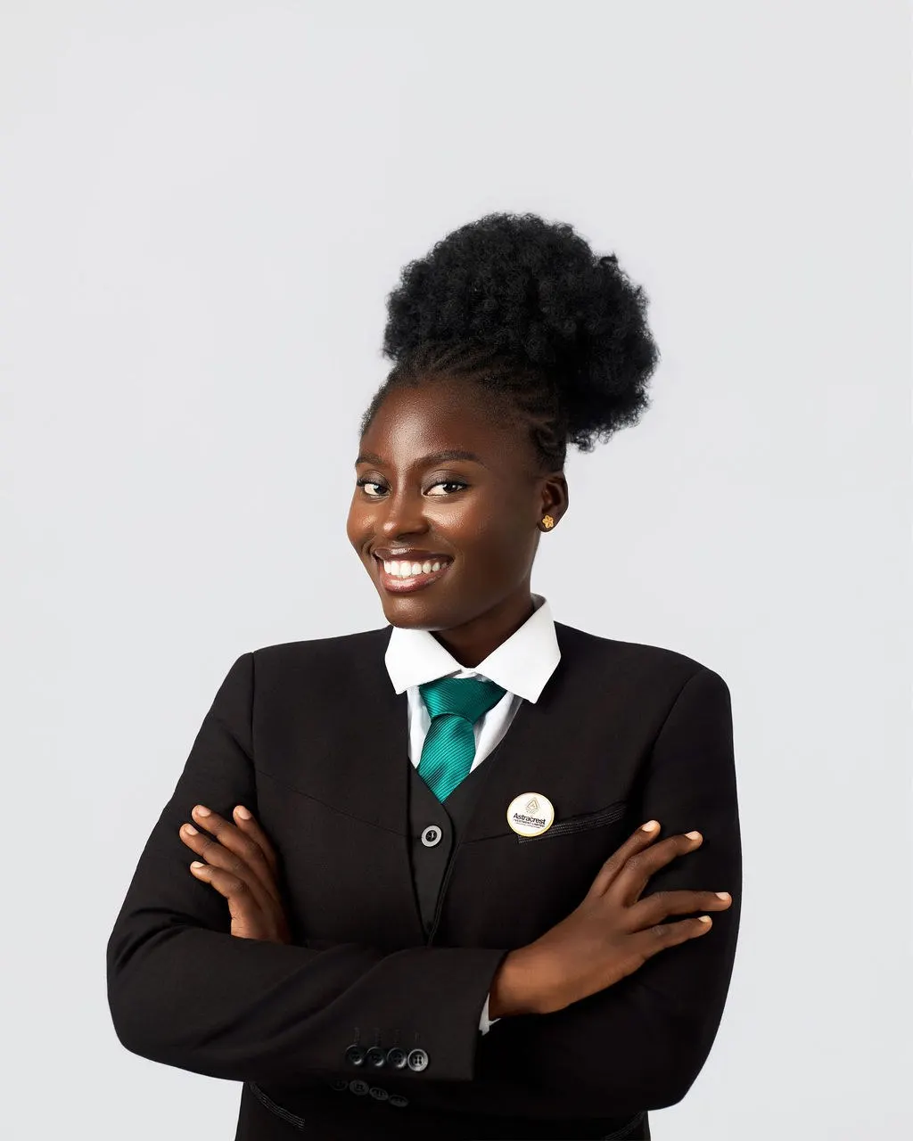 An Astracrest team member in a black suit and green tie